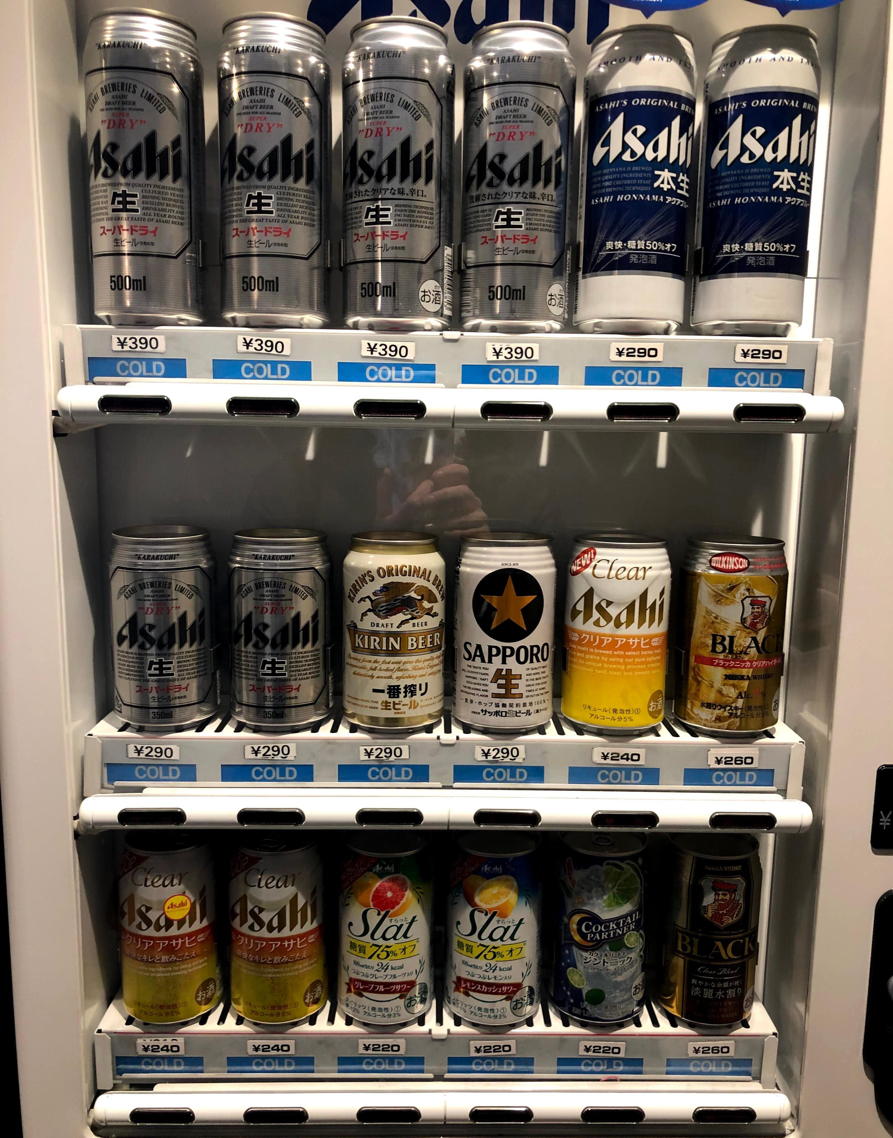 A vending machine full of beer cans